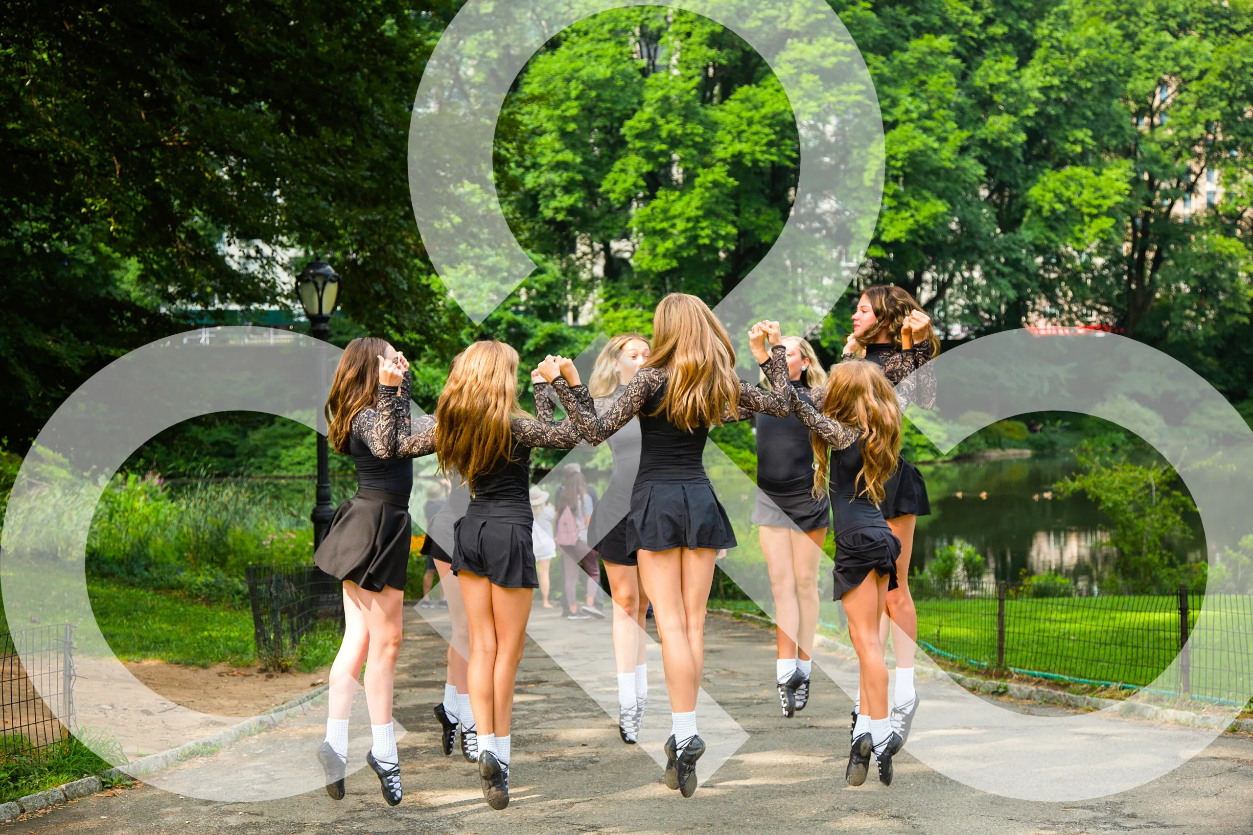 Eight ceili dancers dance in a circle showing off one of the types of Irish dance.